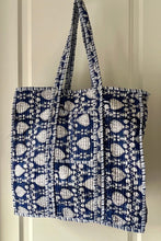 Blue and white boho patterned tote bag on a white background