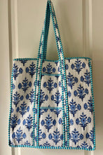 Tote bag with blue floral boho pattern on a white background