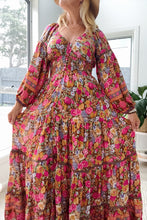 Woman wearing a colorful boho floral dress indoors
