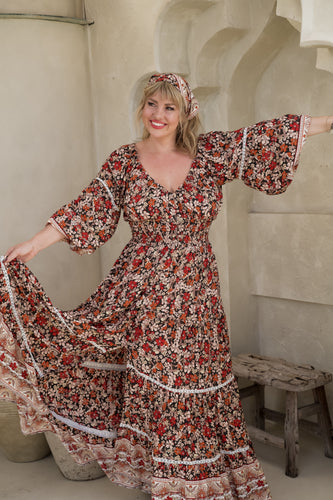 Women wearing bohemian maxi dress 3/4 sleeve flowy dress in beige background