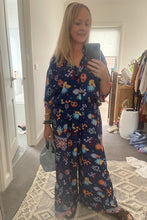 Woman wearing bohemian wide leg pants.