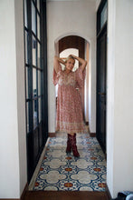 Woman wearing a floral boho dress 