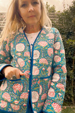 Woman wearing a floral patterned jacket outdoors