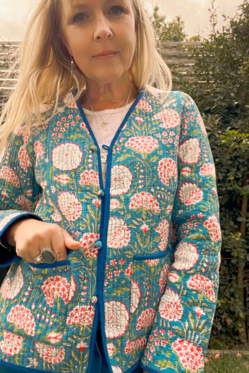Woman wearing a floral patterned jacket outdoors